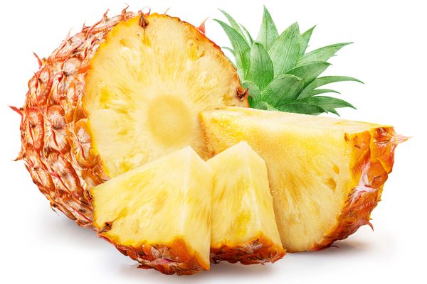 Ripe pineapple and pineapple slices isolated on white background. File contains clipping path.
